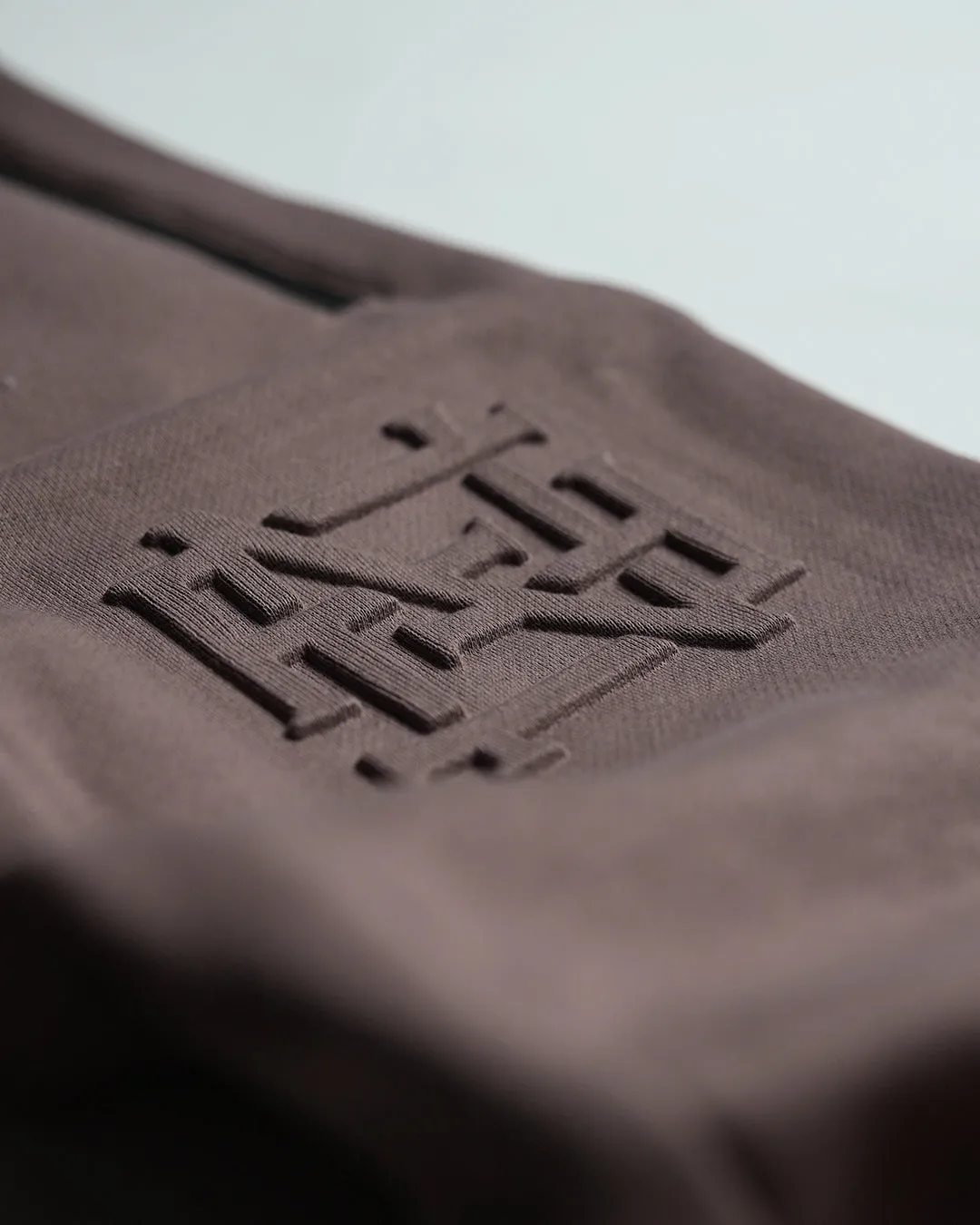 EMBOSSED FITTED JOGGERS-EARTH